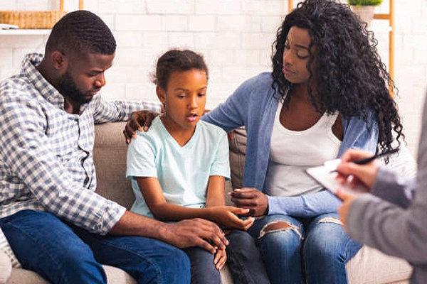 a family talking to a therapist